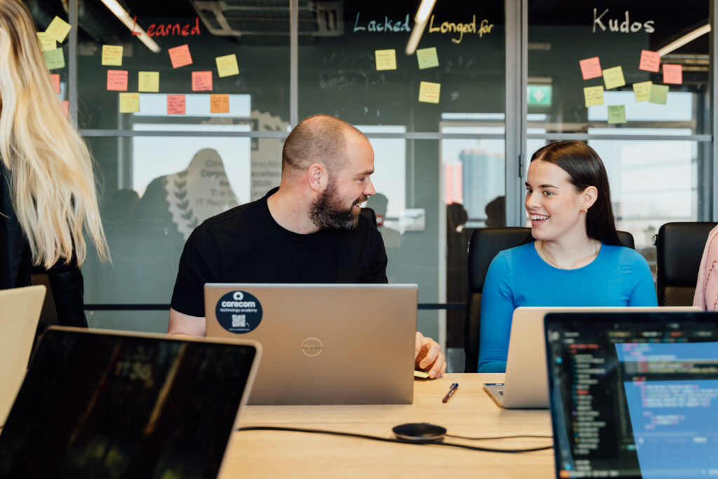 CoreCom colleagues conversing