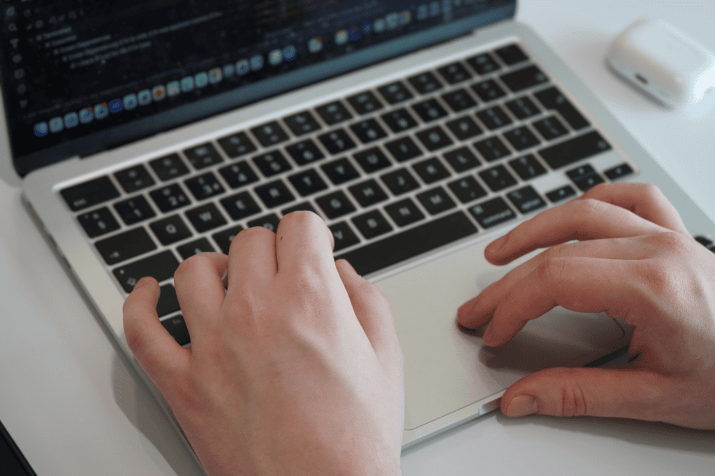Laptop Typing - Corecom Tech Academy